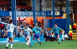 Alan Harper brings the ball out of defence