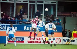 Trevor Peake is beaten to the ball