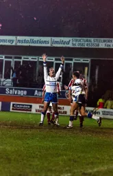 Kerry Dixon celebrates completing his hat-trick after scoring the fifth goal