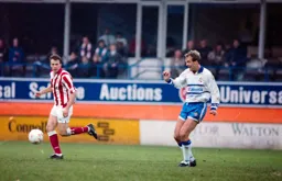 Kerry Dixon plays the ball forward