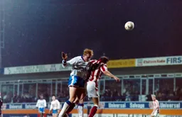 John Hartson wins a header