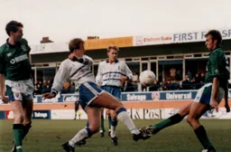 Kerry Dixon is blocked by Mark Proctor