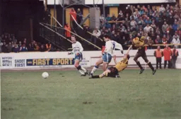 Paul Telfer`s progress is halted by a sliding tackle