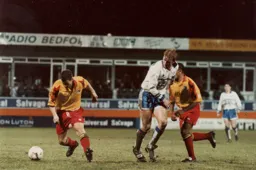 The ball runs away from John Hartson