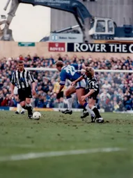 Kerry Dixon shrugs off a challenge by Barry Venison