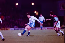 Paul Telfer slotting the ball to a teammate