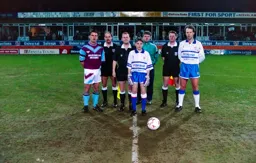 Trevor Peake lines up pre match with West Ham captain Steve Potts, the march officials and mascot
