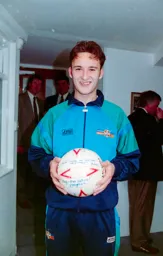 Scott Oakes hat-trick hero with the match ball signed by his team mates