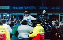 Scott Oakes is carried shoulder high from the field by delerious supporters