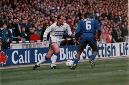 Kerry Dixon is closed down by Frank Sinclair