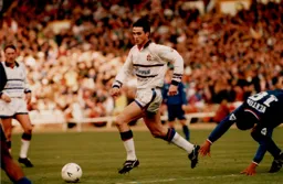 Ceri Hughes gets past a stumbling Eddie Newton