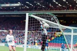 Kerry Dixon watches the keeper tip the ball over the bar
