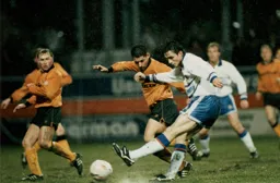 Ceri Hughes fires in a shot on the very wet playing surface
