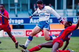 Paul Telfer has the ball taken from him