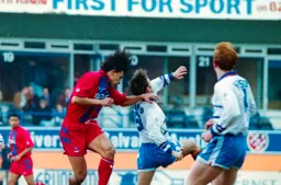 Scott Oakes in a battle with Palace defender Coleman