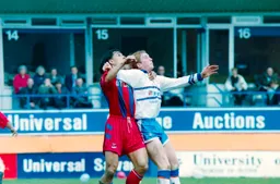 John Hartson in a tussle