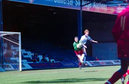 John Hartson makes the keeper work