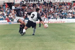 Paul Telfer slips the ball inside