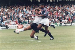 Dwight Marshall is beaten to the ball with desperate defending