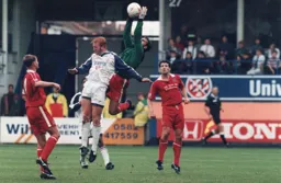 John Hartson challenges City goalkeeper Keith Welch