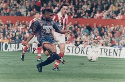 Dwight Marshall about to open the scoring leaving former Hatter John Dreyer in his wake