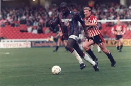 Mitchell Thomas gets forward with the ball