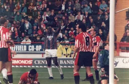Mitchell Thomas signals a Blades own goal