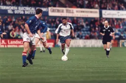 Dwight Marshall advances on goal