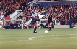 The referee is about to blow up for a foul on Dwight Marshall