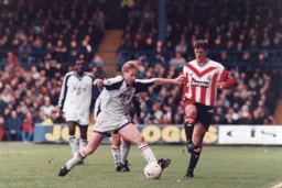 Gary Waddock tries to hold off Matt Le Tissier