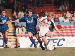 Gary Waddock gets away from Southend's Ronnie Whelan