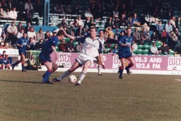 Rob Matthews in a midfield tussle