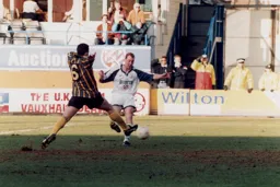 Rob Matthews in a midfield tussle