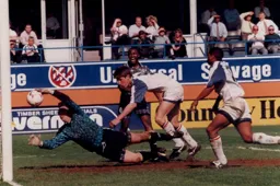 Notts goalkeeper Steve Cherry manages to hang on to the ball