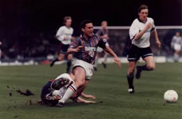 Paul Telfer is brought down when through on goal