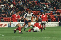 Paul Telfer tries to block a clearance