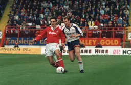 Rob Matthews in a race for the ball