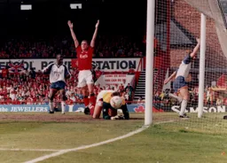 John Taylor wheels away in delight after scoring