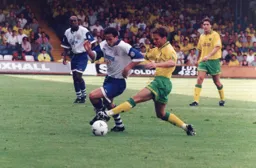 Ceri Hughes tries to take the ball past Darren Eadie