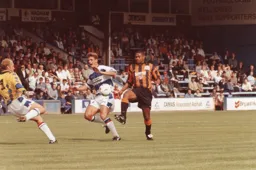 Dwight Marshall is about to be gifted a goal as the two Reading men collide