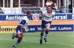 John Taylor races to congratulate Dwight Marshall on his goal