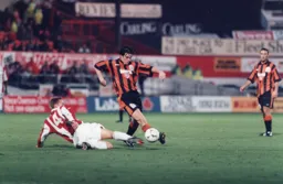 Ceri Hughes powers forward with the ball