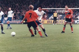 Ceri Hughes in a midfield battle