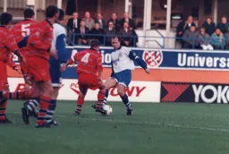 Trevor Peake about to be block tackled