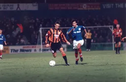 Scott Oakes tries to keep the ball away from Jimmy Carter