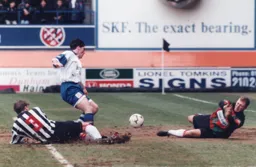 Tony Thorpe is thwarted by Grimsby goalkeeper Paul Crichton