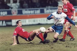 David Oldfield is tackled by Jeff Hopkins