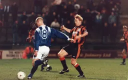 Gary Waddock with another trademark defensive challenge