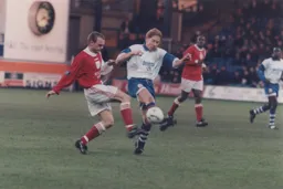 Gary Waddock getting the better of a young Danny Murphy