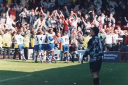 The Town players celebrates goals by Kiwomya and Davis but unfortunately lose for the first time in seven